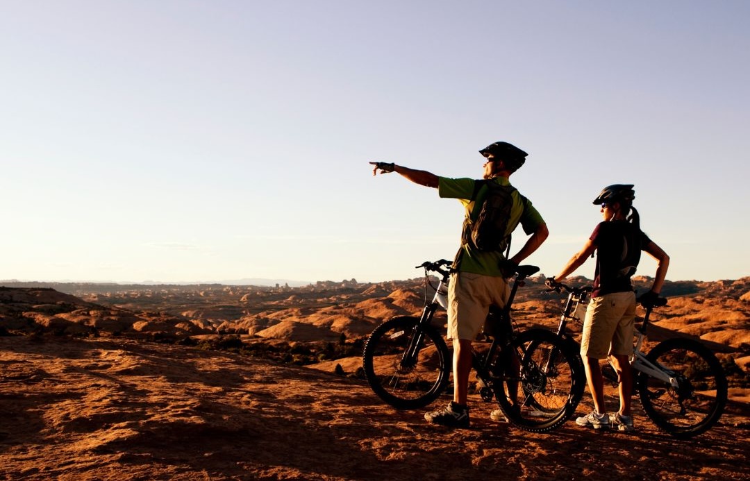image of two people on their mountain bikes enjoying the hurricane utah views.